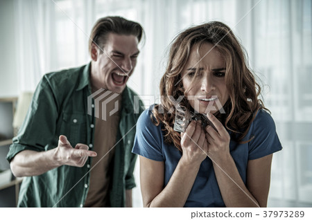 Terrified lady suffering from male cruelty 37973289