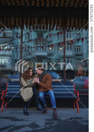 Happy loving couple dating in city 37973295