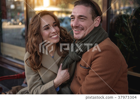 Happy loving couple relaxing outside Happy loving couple relaxing outside 37973304