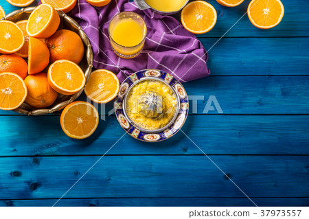 Hand juicer and fresh oranges.Tropical fresh fruit Hand juicer and fresh oranges.Tropical fresh fruit 37973557