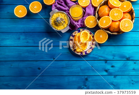 Hand juicer and fresh oranges.Tropical fresh fruit Hand juicer and fresh oranges.Tropical fresh fruit 37973559