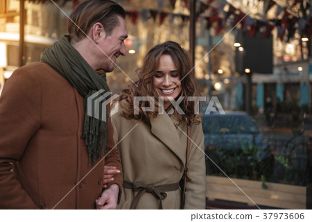 Happy couple walking outdoor with pleasure 37973606