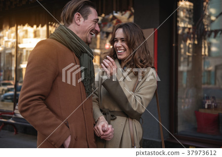 Excited loving couple talking on date Excited loving couple talking on date 37973612