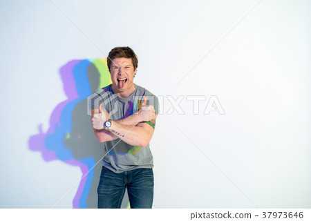 Aggressive man putting out tongue 37973646