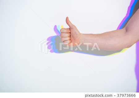 Male arm showing thumb up Male arm showing thumb up 37973666