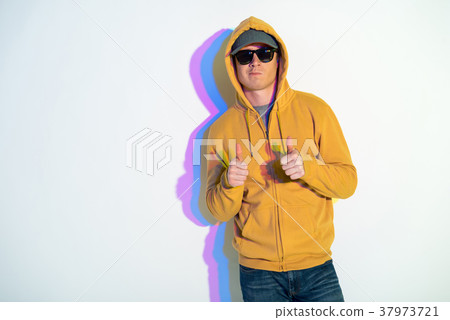 Assured man keeping thumbs up 37973721