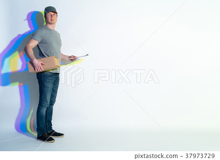 Cheerful man standing with parcel 37973729