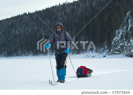 skier with a cargo sled skier with a cargo sled 37973844