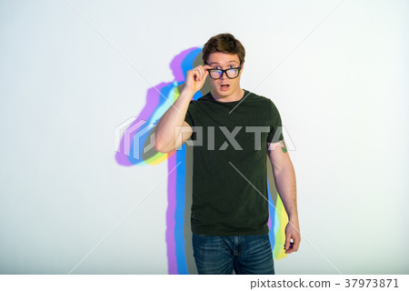 Smart young man demonstrating amazement 37973871