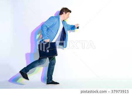 Amazed male looking at watch Amazed male looking at watch 37973915