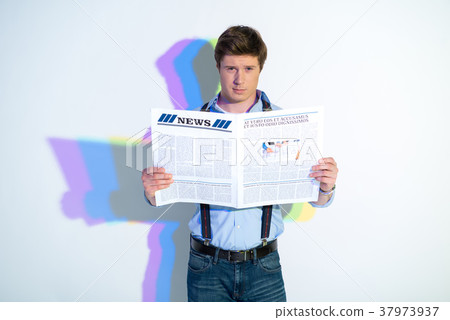 Assured male reading interesting article 37973937