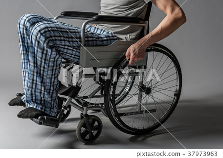 Fixed male legs sitting in armchair 37973963
