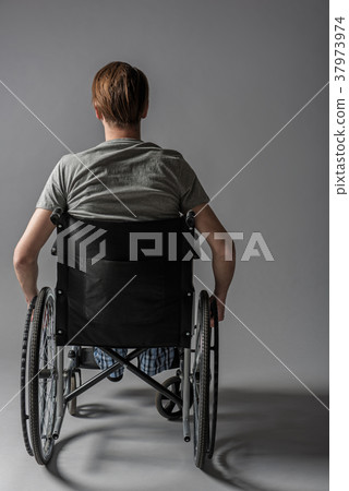 Paralyzed man using vehicle for disabled 37973974