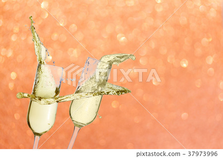 Two festive champagne glasses Two festive champagne glasses 37973996