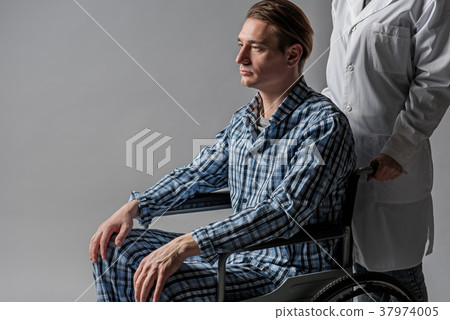 Upset handicapped receiving care from caregiver Upset handicapped receiving care from caregiver 37974005