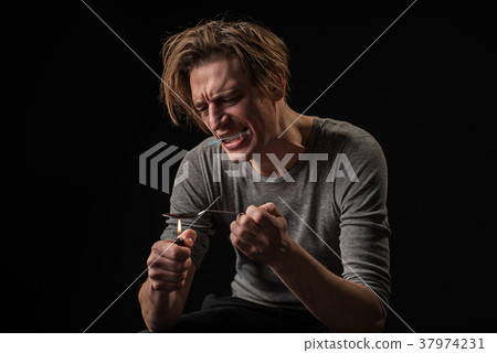 Man in drug hangover readying dose Man in drug hangover readying dose 37974231