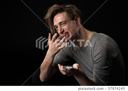 Depressed junkie using dried drugs Depressed junkie using dried drugs 37974245