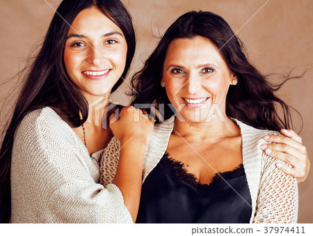 cute pretty teen daughter with mature mother 37974411