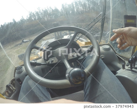 Tractor interior inside during working process Tractor interior inside during working process 37974943