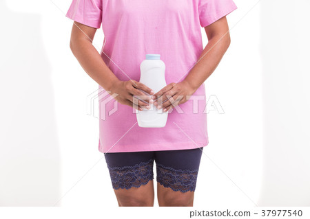 Ovarian cancer concept. Woman holding white powder isolated on white. Powder is cause of ovarian cancer. Saved with clipping path 37977540