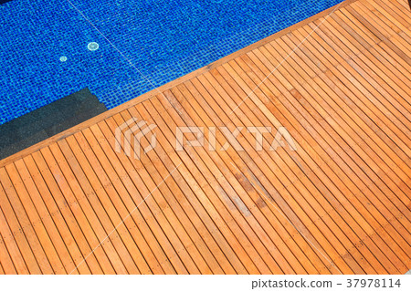 Wooden flooring beside the pool Wooden flooring beside the pool 37978114