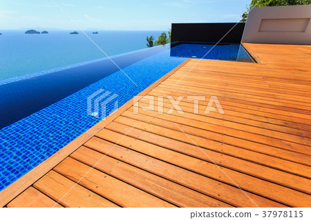 Wooden flooring beside the pool Wooden flooring beside the pool 37978115