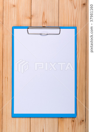 clipboard with blank white paper sheet on wood 37981160