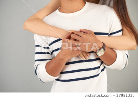 Young Woman Embracing Her Boyfriend Young Woman Embracing Her Boyfriend 37981333