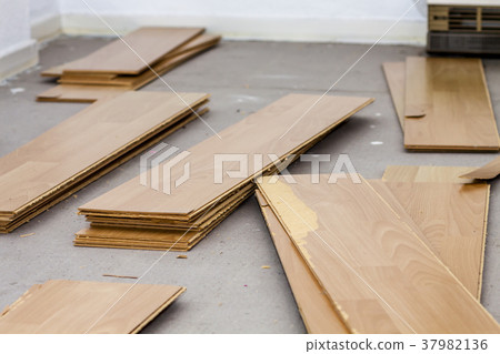 Room full of removed laminate lying on floor 37982136