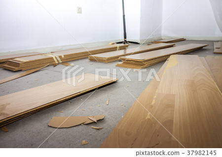 Room full of removed laminate lying on floor 37982145