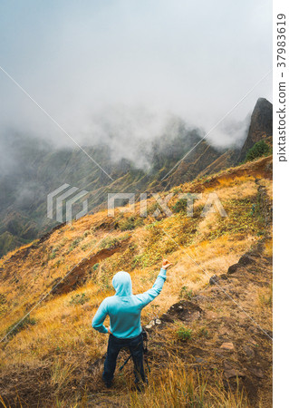 Traveler staying on the cobbled path and admiring Traveler staying on the cobbled path and admiring 37983619