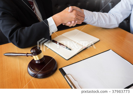Gavel Justice hammer on wooden table with judge and client shaki 37983773