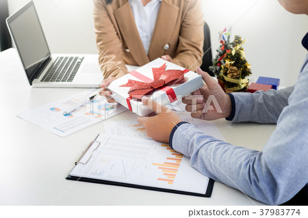 happy business people chatting while celebrating Christmas in of happy business people chatting while celebrating Christmas in of 37983774