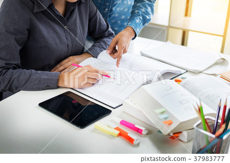 Young students campus helps friend catching up and learning tuto Young students campus helps friend catching up and learning tuto 37983777