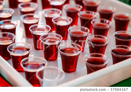 Grape juice in the Plastic cups for Holy Communion Grape juice in the Plastic cups for Holy Communion 37984167