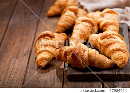 croissants on a wooden board croissants on a wooden board 37984634