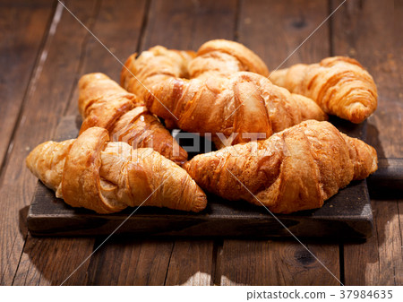 croissants on a wooden board croissants on a wooden board 37984635