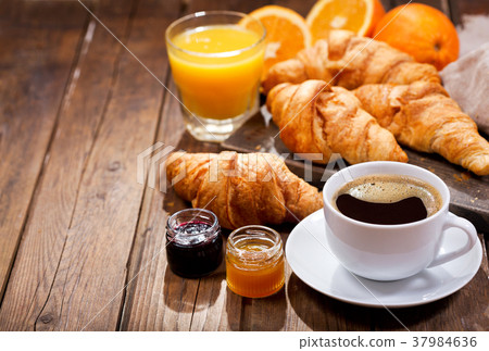 breakfast with cup of coffee and croissants breakfast with cup of coffee and croissants 37984636