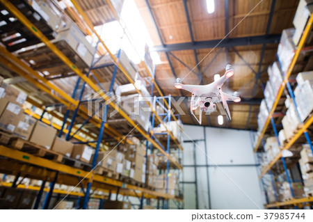 Drone flying inside the warehouse. Drone flying inside the warehouse. 37985744