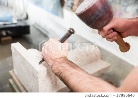 Stonemason working at marble pillar Stonemason working at marble pillar 37986646