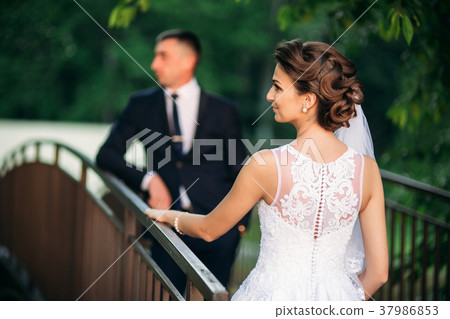 Young couple, bride and groom walking and enjoying 37986853