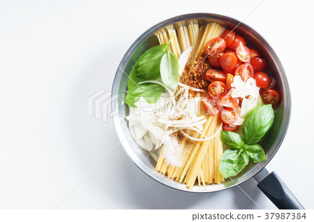 spaghetti with ingredients for cooking spaghetti with ingredients for cooking 37987384