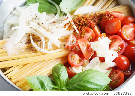 spaghetti with ingredients for cooking spaghetti with ingredients for cooking 37987385