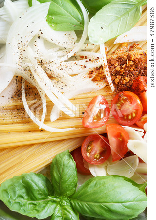 spaghetti with ingredients for cooking spaghetti with ingredients for cooking 37987386