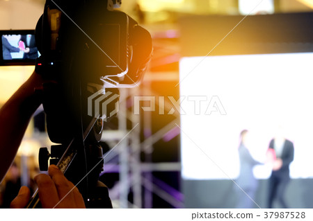 Photographer video recording activity event Photographer video recording activity event 37987528