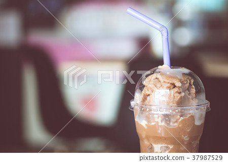 Cocoa or Frappe coffee with tube and lid takeaway Cocoa or Frappe coffee with tube and lid takeaway 37987529