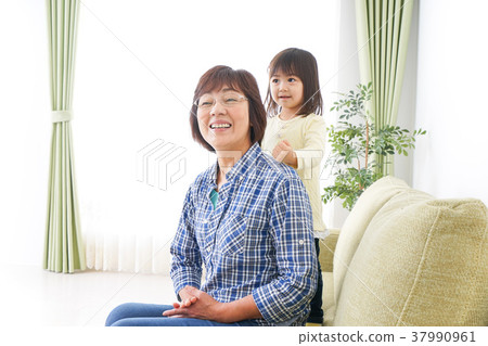 Child playing with grandma 37990961
