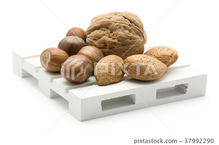 Raw mixed nuts isolated on white Raw mixed nuts isolated on white 37992290
