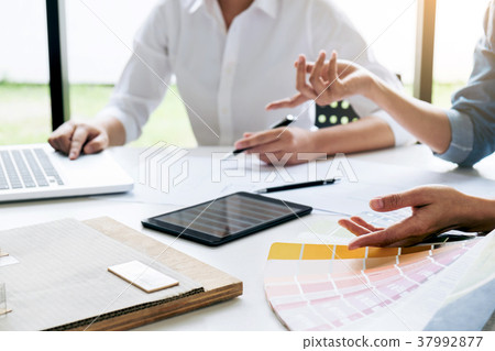 Two interior design or graphic designer at work on project of ar Two interior design or graphic designer at work on project of ar 37992877