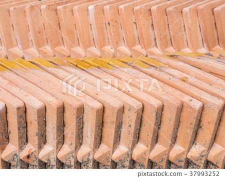 Closeup of the orange tiles stack. Closeup of the orange tiles stack. 37993252
